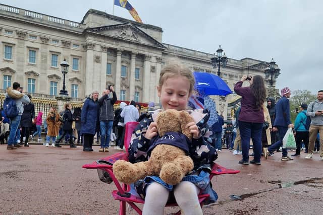 Rugby schoolgirl Harli and Betty the classroom bear at Buckingham Palace.