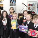 Students with the items at Avon Valley School.