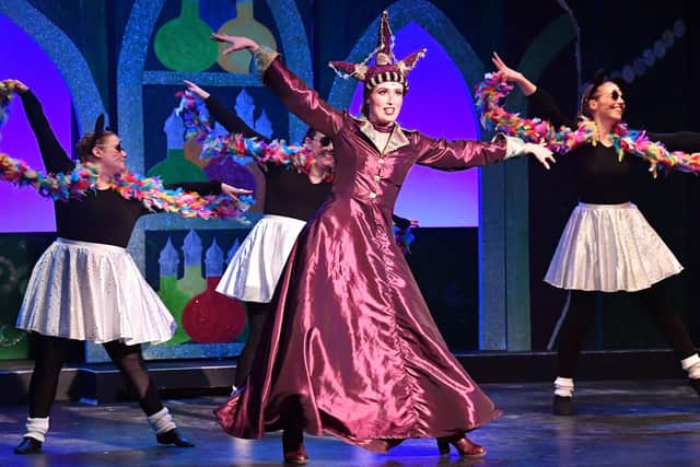 The Evil Queen, played by Libby Lowe, shows off her moves, with the Narrators in the background, played by Suzanne Swan, Kristel Bianco and Rosie Fuller. Photo: Martin Pulley.