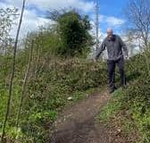 Dave Steele [70] showing the current state of path which he hopes will become a fully accessible ramp to the Grand Union canal .This is on left hand side of Radford Road from the Southam direction. He brokered the purchase of the land which is owned by the Canal and River Trust. Picture supplied.