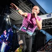 Coldplay performs at Parken Stadium in Copenhagen. Photo by Mads Claus Rasmussen / Ritzau Scanpix / AFP via Getty Images