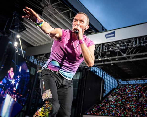 Coldplay performs at Parken Stadium in Copenhagen. Photo by Mads Claus Rasmussen / Ritzau Scanpix / AFP via Getty Images