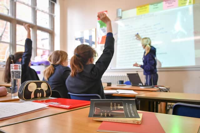 File photo dated 12/09/18 of a teacher and students in a classroom. The UK Health Security Agency (UKHSA) has issued back-to-school advice amid high levels of flu, Covid-19 and invasive Strep A disease (iGas). The advice includes simple steps that can minimise the spread of illness in education and childcare settings as well as the wider community. Issue date: Monday January 2, 2023.