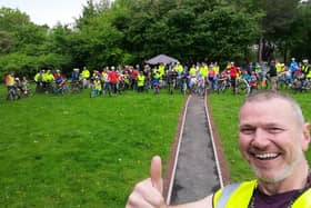 Simon Storey with the group of Kidical Mass riders behind him.