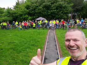 Simon Storey with the group of Kidical Mass riders behind him.