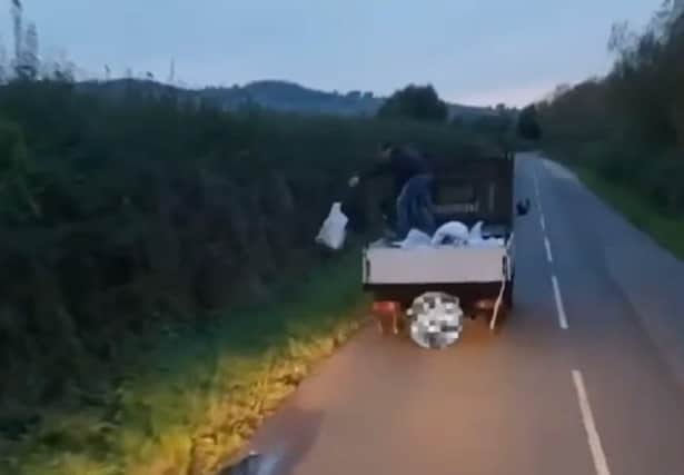 A flytipper was caught on video throwing bags of rubbish from the back of a truck into the countryside. (footage from video by Warwickshire Rural Crime Team)