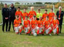 Darren Fox and Will Solomon, co-managers of Rugby Borough Under 13s, alongside Bellway’s Tina Yates and the Rugby Borough U13s Tigers team