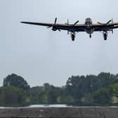The City of Lincoln Lancaster Bomber takes to the sky for the memorial flight of the 80th anniversary of the WWII Dambusters Raid at RAF Coningsby