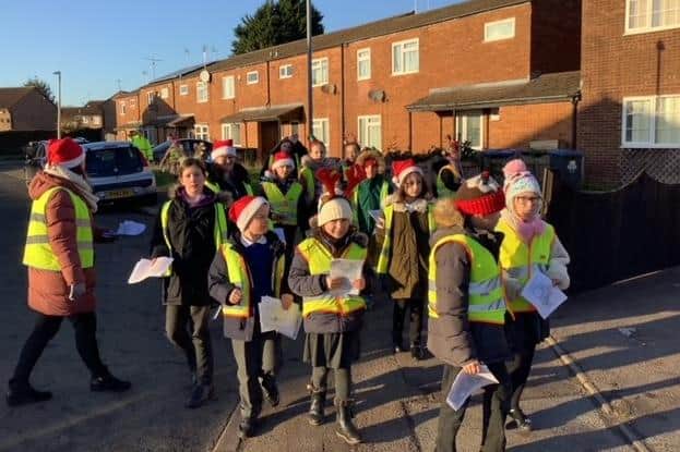 Special delivery - Boughton Leigh Junior pupils out and about sharing their poems with their neighbours.