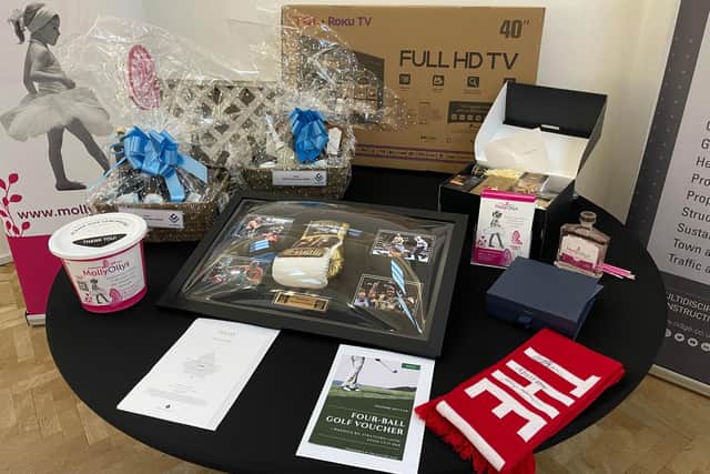 Sporting memorabilia – including a Tyson Fury boxing glove – a golf day for four, HDV TV and wine hamper were among the lots being bid on in a charity auction on the night. Photo supplied