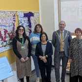 Cllr Maggie O'Rourke, Rugby Borough Council portfolio holder for partnerships and wellbeing, and (centre) the Mayor of Rugby, Cllr Simon Ward, joined members of the Houlton WI at the International Women's Day display at Rugby Art Gallery and Museum.