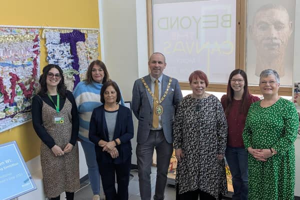 Cllr Maggie O'Rourke, Rugby Borough Council portfolio holder for partnerships and wellbeing, and (centre) the Mayor of Rugby, Cllr Simon Ward, joined members of the Houlton WI at the International Women's Day display at Rugby Art Gallery and Museum.