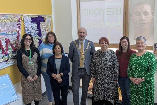 Cllr Maggie O'Rourke, Rugby Borough Council portfolio holder for partnerships and wellbeing, and (centre) the Mayor of Rugby, Cllr Simon Ward, joined members of the Houlton WI at the International Women's Day display at Rugby Art Gallery and Museum.