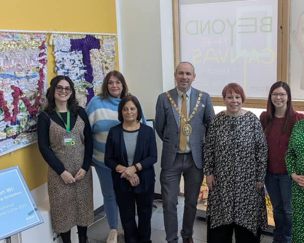 Cllr Maggie O'Rourke, Rugby Borough Council portfolio holder for partnerships and wellbeing, and (centre) the Mayor of Rugby, Cllr Simon Ward, joined members of the Houlton WI at the International Women's Day display at Rugby Art Gallery and Museum.