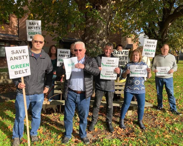 A library picture of Ansty Parish Chair Cllr Grahame Fox-Dowden ripping up Rugby Borough Council’s Local Plan with other members of the Save Ansty Greenbelt group.