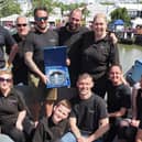 The Bespoke Boat Company team with the trophy for Favourite Widebeam at Crick Boat Show  2024 on the roof deck of their winning boat Lunar.