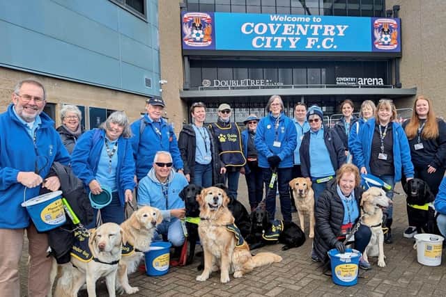 Volunteers and dogs from charity Guide Dogs outside the CBS Arena.