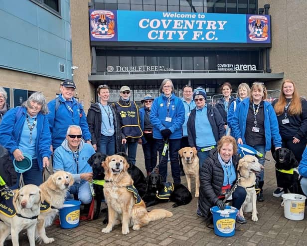 Volunteers and dogs from charity Guide Dogs outside the CBS Arena.