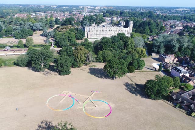 Positioned in Warwick Castle Farm Park field, the bike’s frame was made from 252 straw bales, each measuring 81 x 46 x 31 cm and weighing 18 kg, with its wheels built from brightly coloured material to match the Commonwealth Games Colours. Photo supplied by Warwickshire County Council