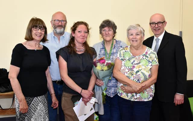 Kay Bugg (trustee), Dave Rawcliffe (Chair of trustees), Kate Cliffe (manager of the Sydni Centre), Lilian Brocklehurst (volunteer), Glynis Jennings (former trustee) and Matt Western MP.