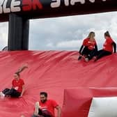 Recently, CEWE staff members took part in a 5K fun run through an inflatable obstacle course. Photo supplied