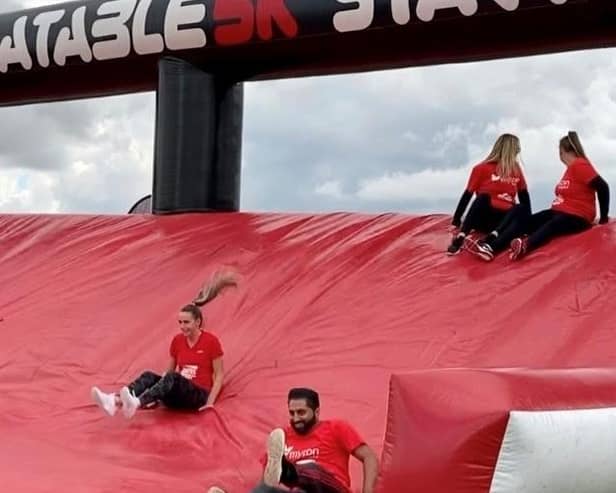 Recently, CEWE staff members took part in a 5K fun run through an inflatable obstacle course. Photo supplied