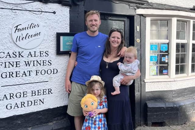 The family in front of the pub
