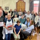 Anne White, WRCC (Warwickshire Rural Community Council) with John Hardman, Hilary Fisher and Barbara Jones from Wolvey Village Hall, with Wolvey volunteers and residents at their Warm Hub