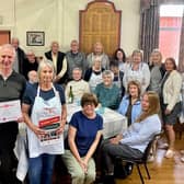 Anne White, WRCC (Warwickshire Rural Community Council) with John Hardman, Hilary Fisher and Barbara Jones from Wolvey Village Hall, with Wolvey volunteers and residents at their Warm Hub