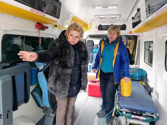 The ambulance being delivered to Ukraine civilians near Zaporizhzhia. From left to right: Sviltlana, the Ukrainian civilian and Roxanne Litynska, the British-based volunteer driver. Photo supplied