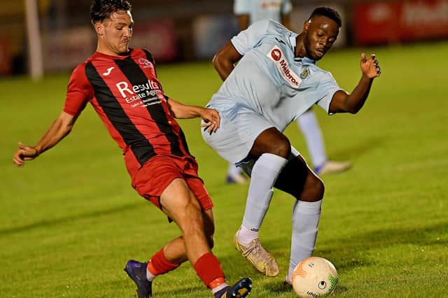 Madundo Semahimbo in action as he scored Rugby Town's second goal in their 7-0 demolition of Rothwell Corinthians. Picture by Martin Pulley