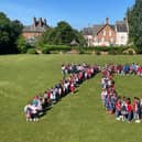 Pupils and staff at St Anthony's Catholic Primary School gathered to form the number 70 on the school playing field as part of their day of celebrating the Queen's Platinum Jubilee.