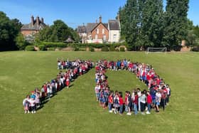 Pupils and staff at St Anthony's Catholic Primary School gathered to form the number 70 on the school playing field as part of their day of celebrating the Queen's Platinum Jubilee.