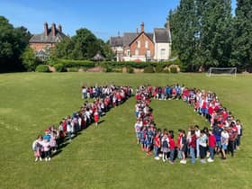 Pupils and staff at St Anthony's Catholic Primary School gathered to form the number 70 on the school playing field as part of their day of celebrating the Queen's Platinum Jubilee.