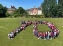 Pupils and staff at St Anthony's Catholic Primary School gathered to form the number 70 on the school playing field as part of their day of celebrating the Queen's Platinum Jubilee.