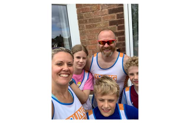 Jo Squires, chief officer at Young People First - pictured here with her family - ran 496 kilometres in July to raise more than £1,000 for the charity. Picture supplied.