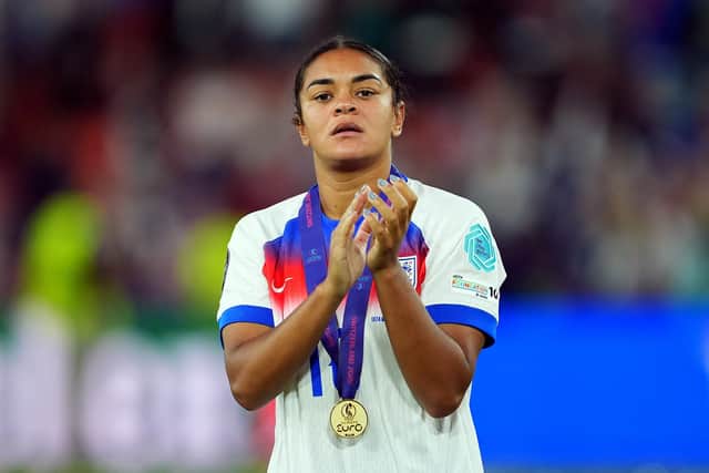 Jess Carter of England acknowledges the fans while wearing her winners medal after the UEFA Women's EURO 2025 Final match(Photo by Daniela Porcelli/Getty Images).