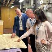 Right to left: Cristina Calleja, Sustainability Manager, pictured with colleagues Mark Wise, Senior Estates Manager, and Nigel Corcoran, Head of Estates, reviewing plans to decarbonise the Warwick Hospital site. Photo supplied