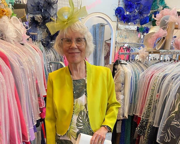 Kate Harris models some of the clothes that will be for sale.