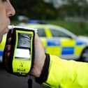 A suspected drink driver who allegedly crashed into three houses has been arrested after a vigilant member of the public followed him to a nearby pub.