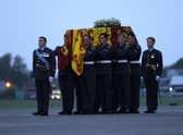 Pallbearers from the Queen's Colour Squadron (63 Squadron RAF Regiment) carry the coffin of Queen Elizabeth II to the Royal Hearse having removed it from the C-17 at the Royal Air Force Northolt airbase on September 13, 2022 in London.