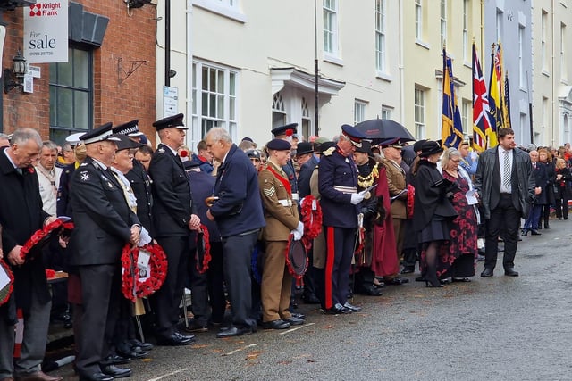 Members of the community gathered in Church Street for the wreath laying at the war memorial. Photo by Warwick Court Leet