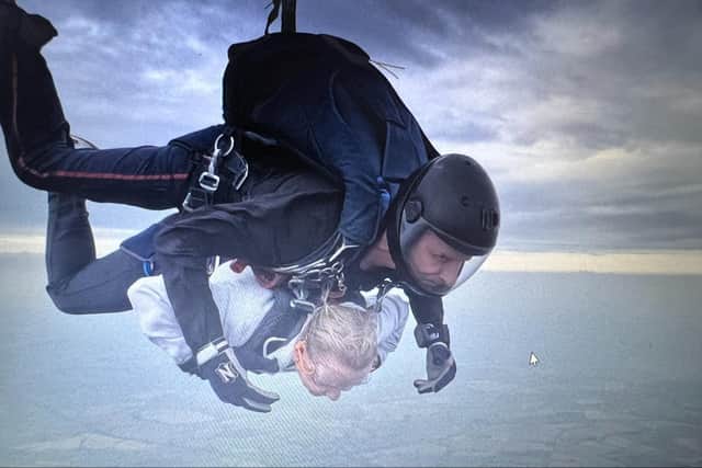 The pair managed to raise more than £1,000 for the charity. Photo shows Ann-Marie Baker, senior customer relations manager at Leycester and Jubilee House, doing her skydive. Photo supplied