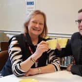 Carin Jackson, retiring Chair of Trustees raising a cuppa to success with Simon Terry, Rugby branch manager of the Hinckley &amp; Rugby Building Society.
