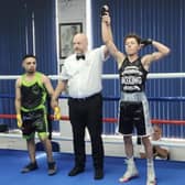 Jamie Ashfield has his hand raised in victory over Aayan Pascha. Pic by Mike Lockley.