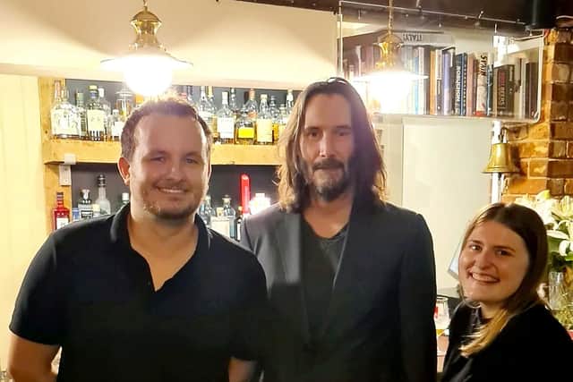 Danny Ricks and Laura James said they "managed to keep it together" while serving Keanu Reeves at The Fox and Hounds at Charwelton.