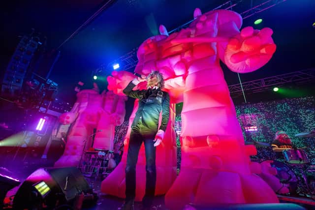 Pink inflatable robots loom large over Flaming Lips frontman Wayne Coyne at the O2 Academy in Birmingham. Photo by David Jackson.