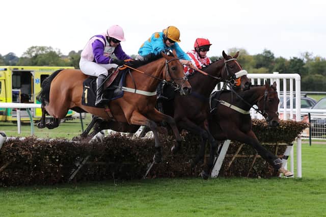 Getalead (left) leads Glimpse Of Gala and Coldstream over the last in the Ignite Incentives Handicap Hurdle