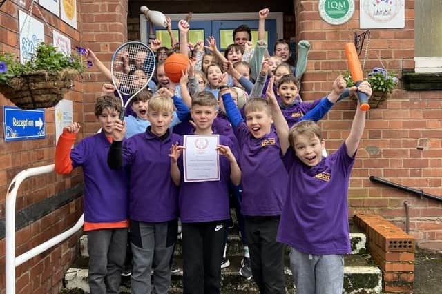 Clapham Terrace Primary School pupils celebrate the school achieving the afPE Quality Mark for Physical Education, School Sport & Physical Activity.