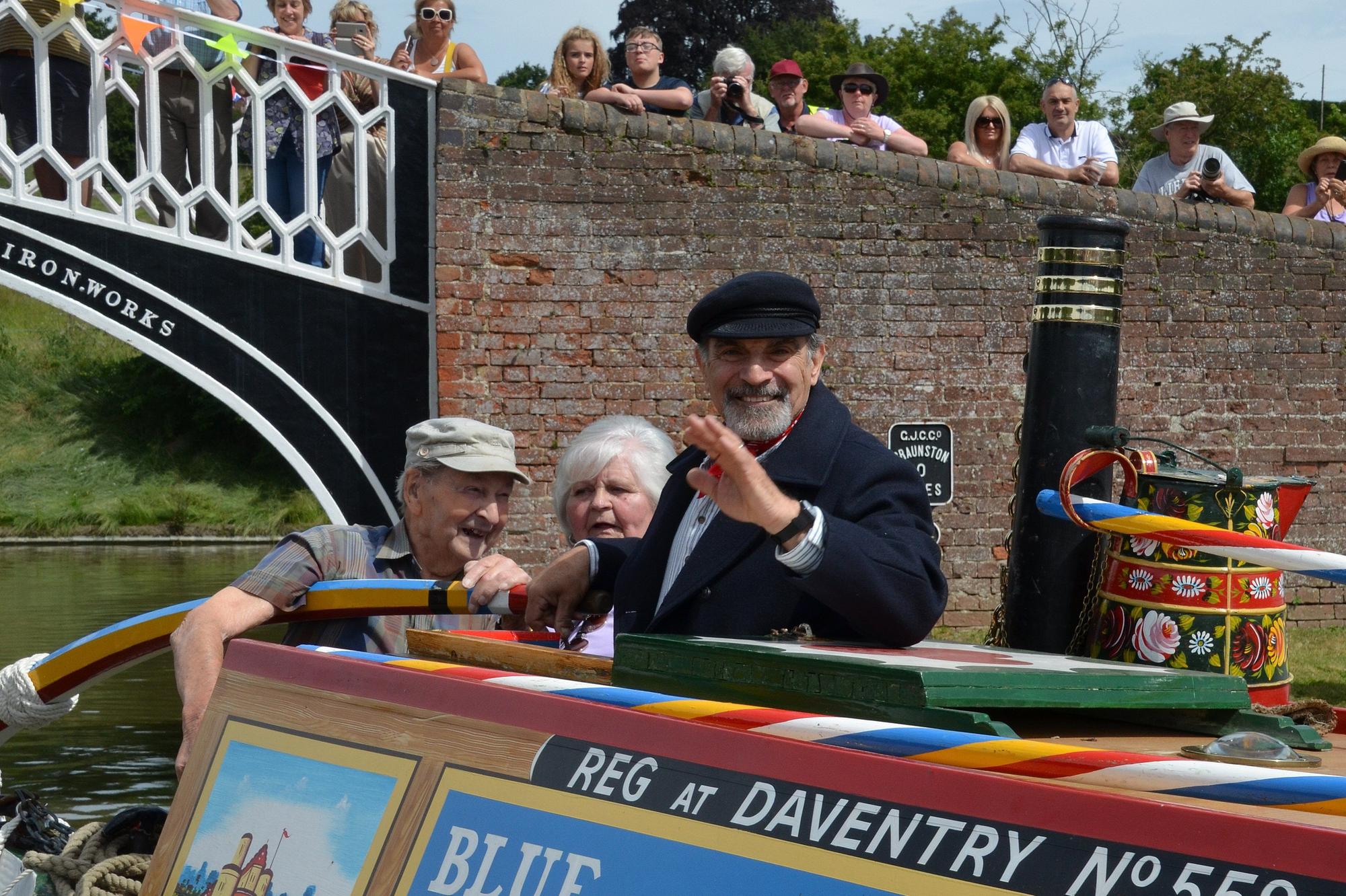 David Suchet pictured opening the 2018 Braunston Historic Narrowboat Rally on the 1958 Braunston-built Raymond narrowboat, together with Aubrey Berriman, who built the boat, and former working boat woman Alice Lapworth.